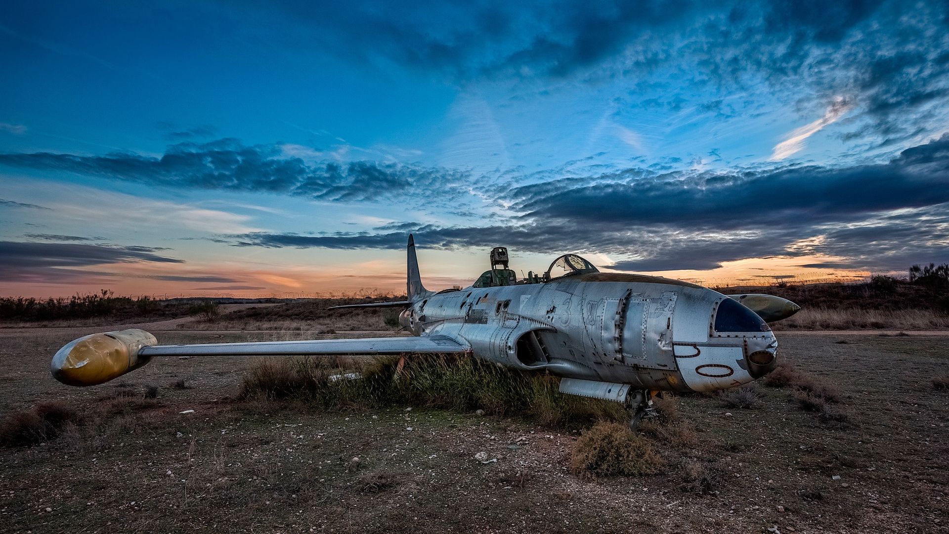 Small_abandoned_plane_sky_clouds-1920x10