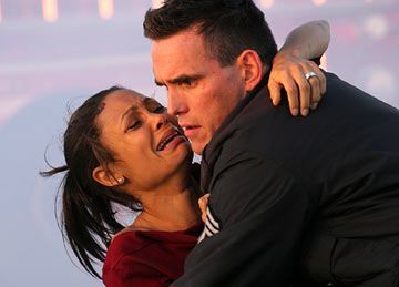 Image from Crash with Matt Dillion holding a crying Thandie Newton