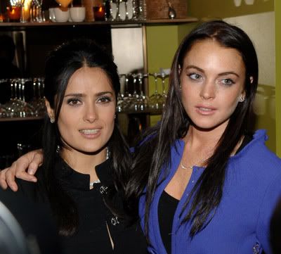 Salma Hayek and Lindsay Lohan with their arms around each other at the Ask the Dust after party