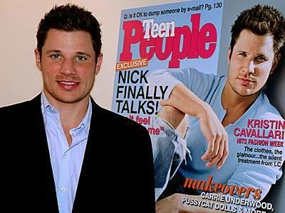 Nick Lachey in front of a blown-up picture of him on the cover of Teen People Magazine