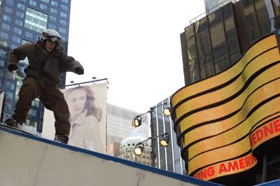 Snowboarder riding a staircase in Times Square