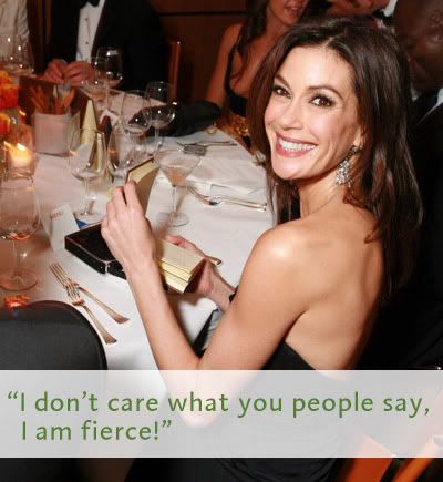 Teri Hatcher smiling at a table at the Vanity Fair party with the caption I don't care what you people say - I am fierce!
