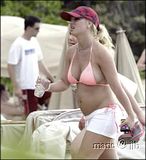 Britney Spears on a beach in Hawaii in a bikini looking pregnant