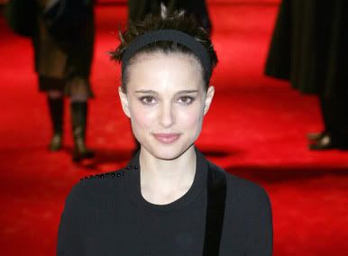 picture of Natalie Portman at the V for Vendetta premiere in a black dress with spiky hair held back with a headband