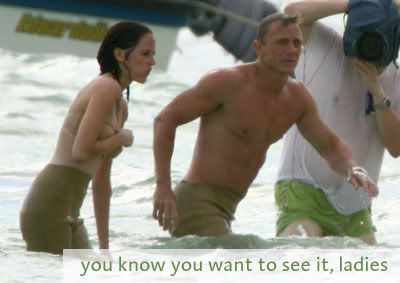 Daniel Craig shirtless filming a scene in the ocean with the caption: you know you want to see it ladies