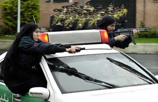 north korean women marching. Two Iranian police women hold