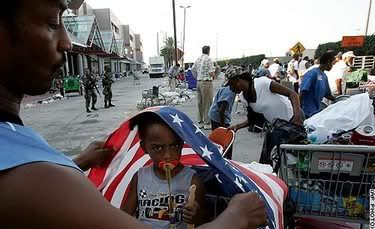 little girl with flag draped around her