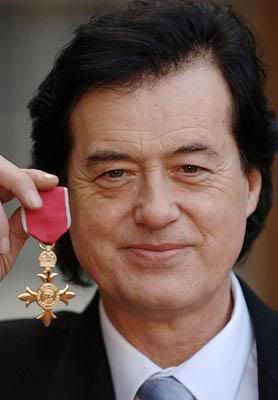 12-14-2005: jimmy page holds up obe medal