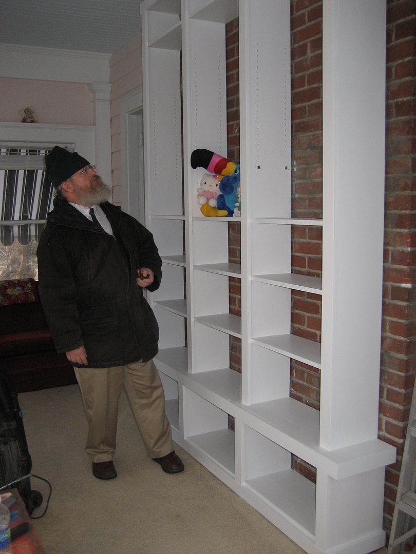Hubby Wayne has a heart-to-heart talk with Toucan Sam, after examining the bookcase that was built in his absence. He never asked if my father had helped built it. 