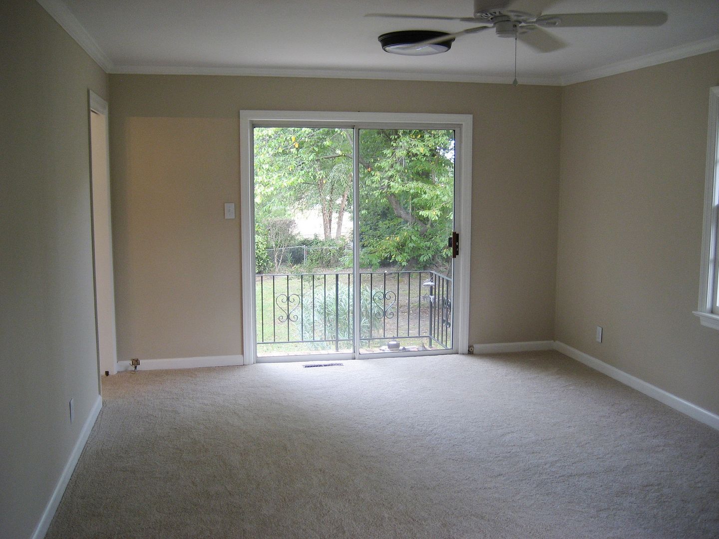 A large den at the far right of the house is filled with large windows, which is another delightful feature. Because theres no attached garage, the house has no blank (windowless) exterior walls.