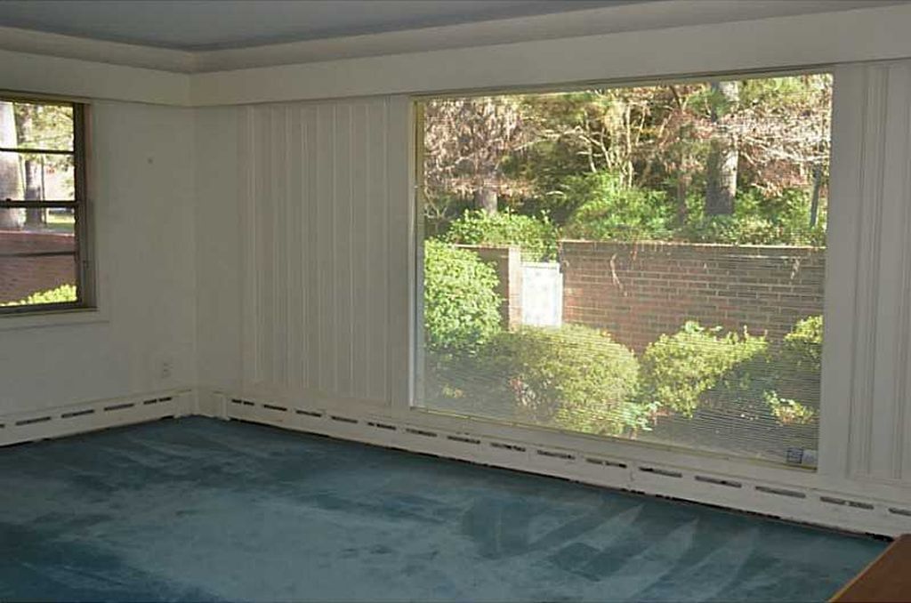 These massive windows define this Mid-Century Modern home, where the outside spaces are brought into the home.