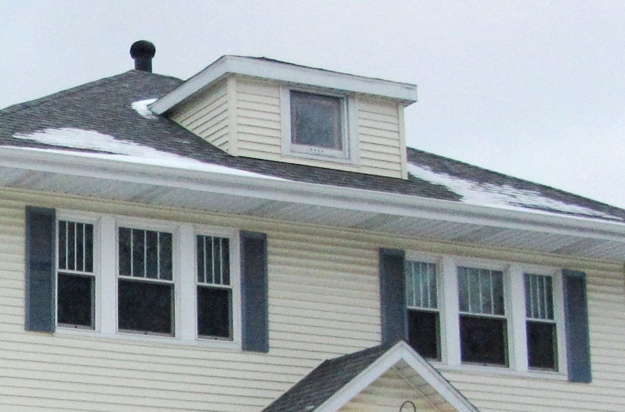The vinyl-siding installers also had their way with the attic window. 