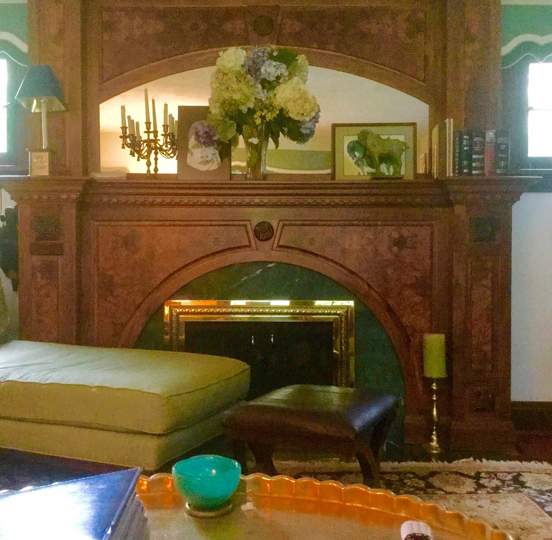 In the Carrolls living room, the Perkins did some repair work to the existing brick fireplace and added this beautiful Walnut mantel. 