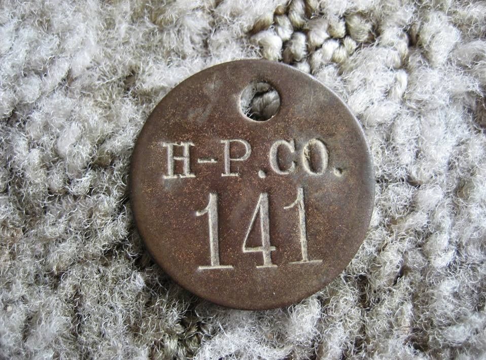 The Georgia was designed by DuPonts architects, and was *probably* built with building materials from North American Construction Company (also known as Aladdin Readi-Cut Homes). The houses were built by Hancock-Pettijohn. Shown below is a chit found at the old Penniman site, maybe used for checking tools out of the tool shed.