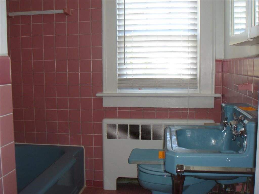 My favorite pink bathroom is a deep rose with blue accents. 