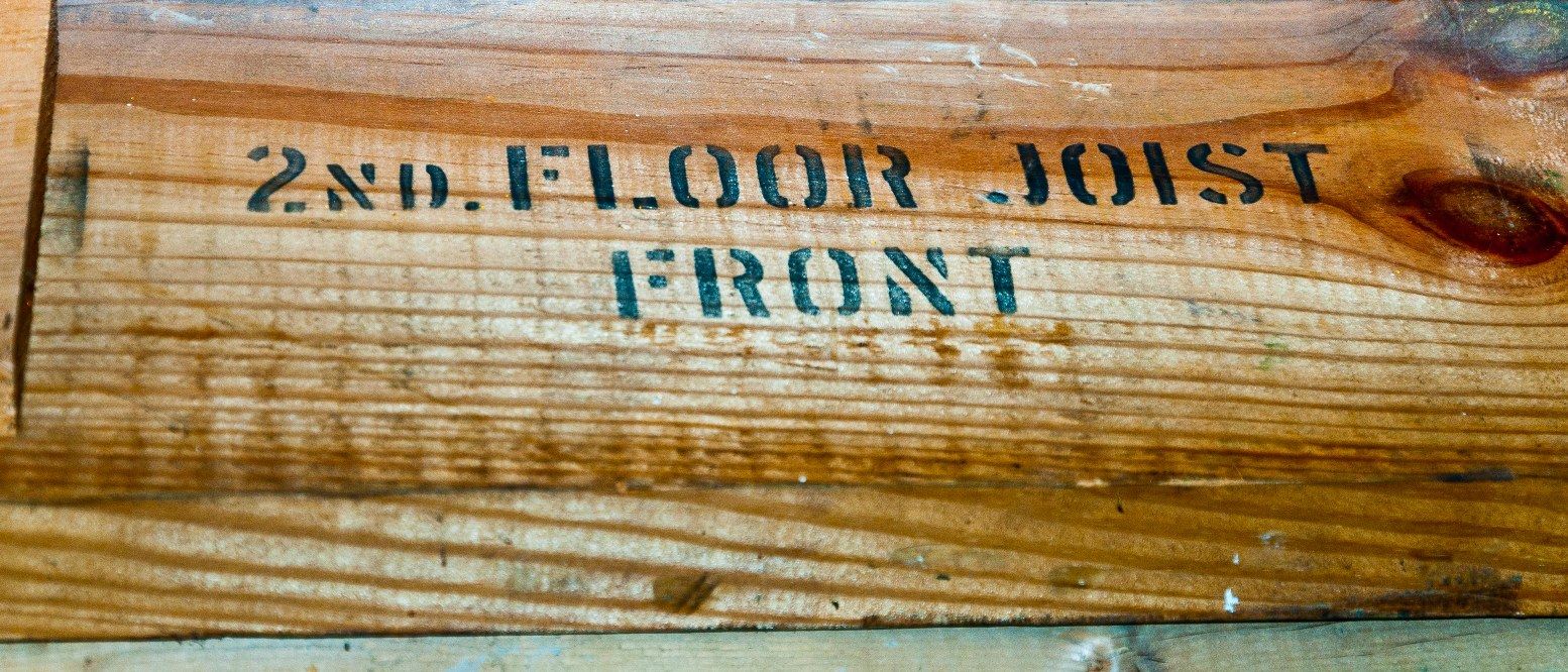 Close-up of the marked lumber Jeffrey found in his Sears House.
