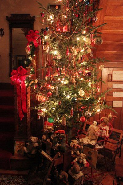 Christmas tree at the foot of the staircase in the mansion. 