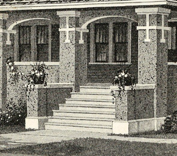 Close-up shows the original planters by the front entry