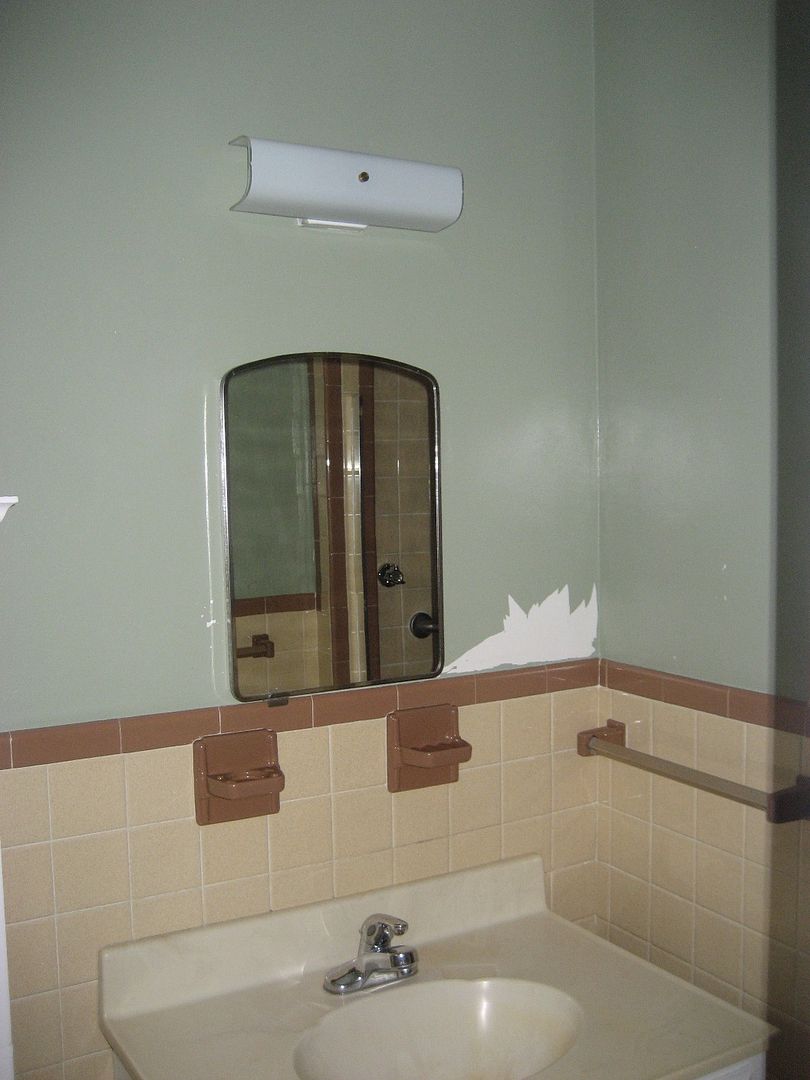 The master bedroom has its own bathroom, and is also in wonderfully original condition. 