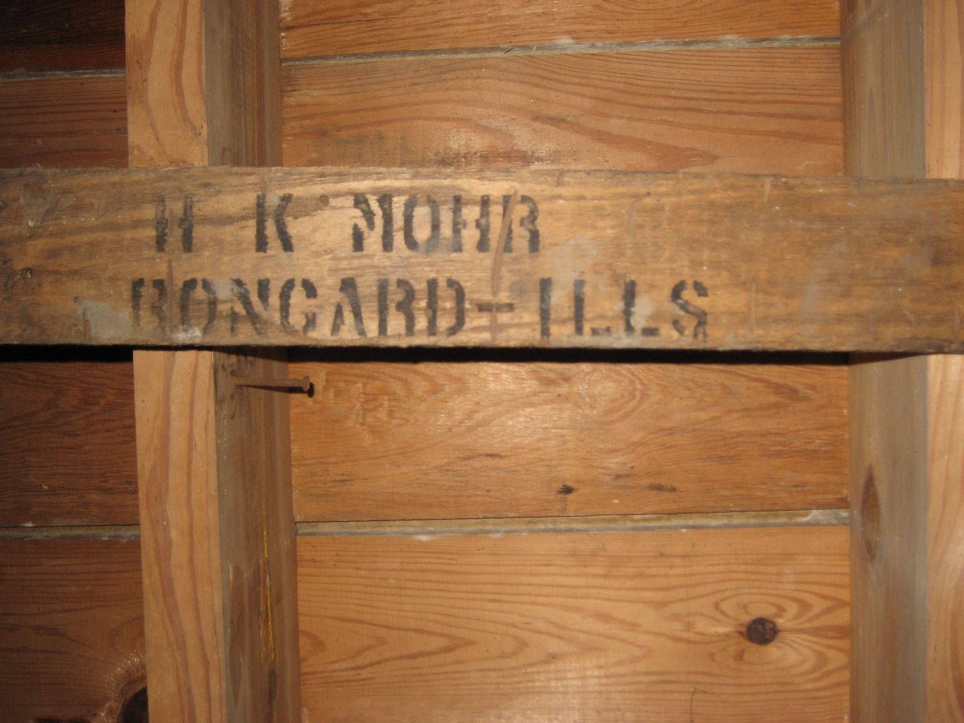 These houses were shipped in wooden crates, marked with the owners name and destination (train station). The shipping crates were often salvaged and the wood was reused to build coal bins or basement shelving. Heres one such remnant found in the basement of the Osborn. 
