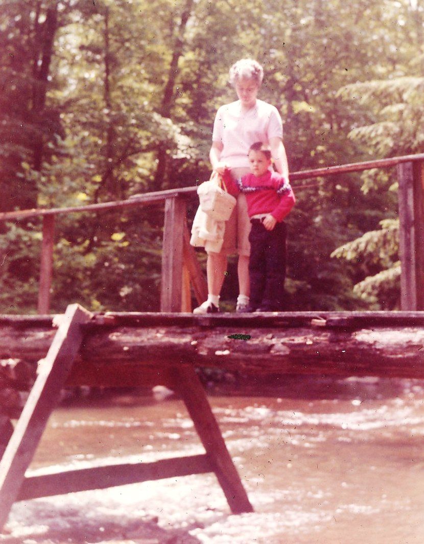 Mother and my youngest brother standing on a pretty ricket bridge over Wilson Creek.