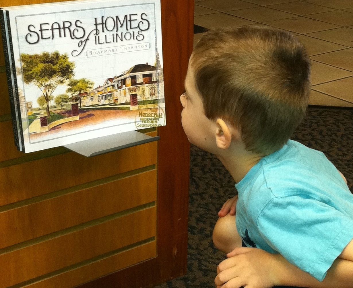 Elias gazing at the new book.