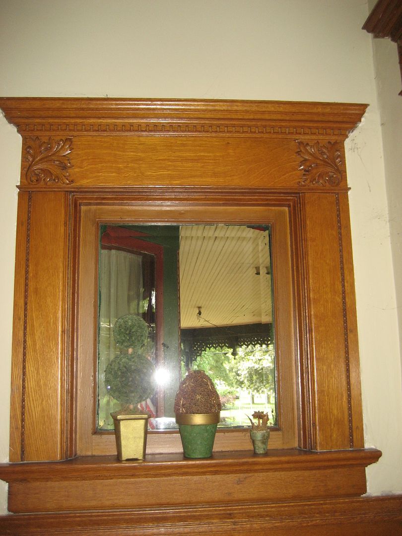 Just inside the main entry is this small (and high) window. Notice the beveled glass and ornate quartersawn oak trim. At first glance, I thought this was a mirror. I thought Id joined Addies world when I stood in front of this mirror and no one was looking back!