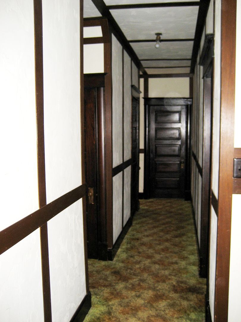 That half-timbered effect is present throughout the long hallway of 