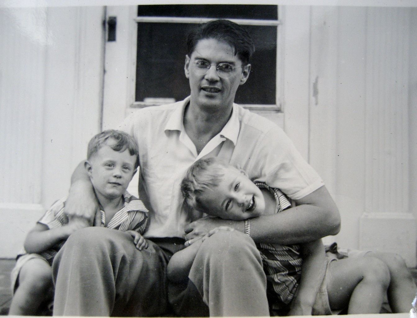 My father in the early 1950s with two of his four children.
