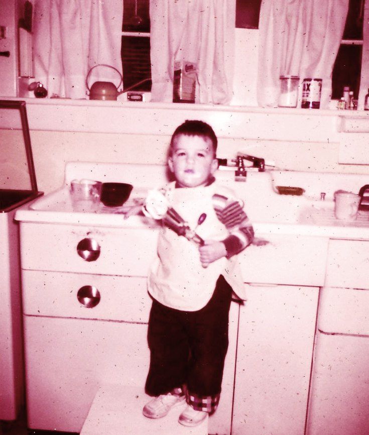 This is one of the happiest pictures I could find. Its my brother Eddie, licking the beaters after Mother had made some wonderful dessert.
