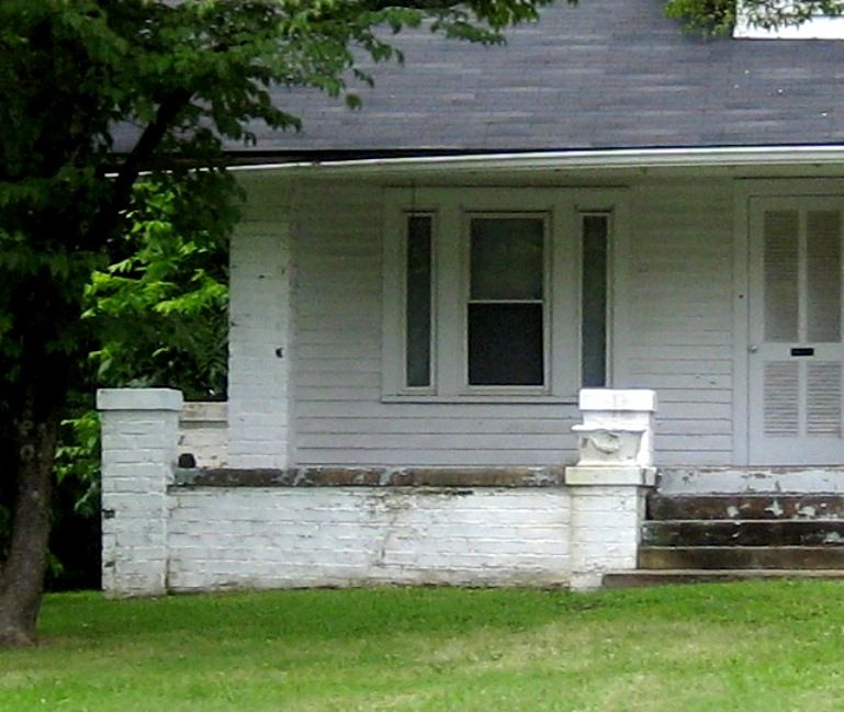 Take a look at the front porch detail. 