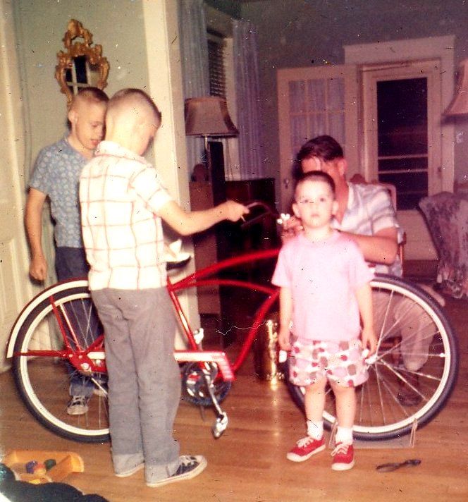 The two oldest boys got shiny new bikes in Summer 1959, and Eddie (the youngest boy) got a new baby sister. Im pretty sure he would have preferred a red bike. 