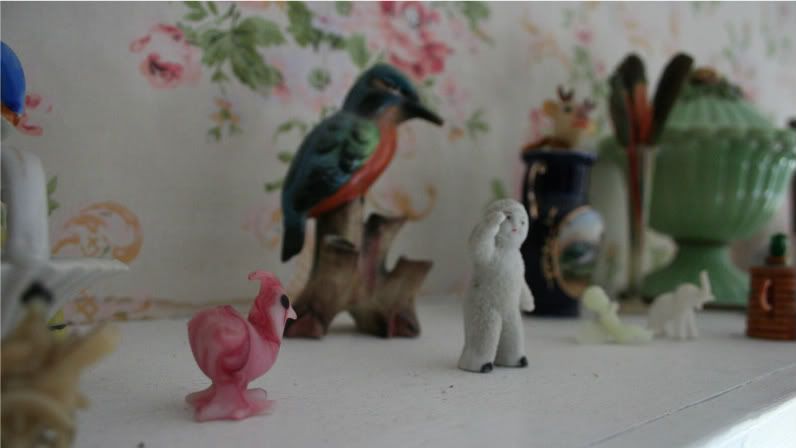 small vintage figurines on shelf