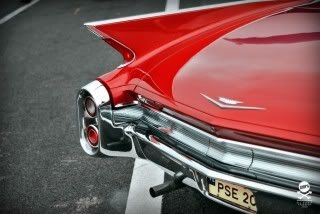 red 1959 cadillac deville fins