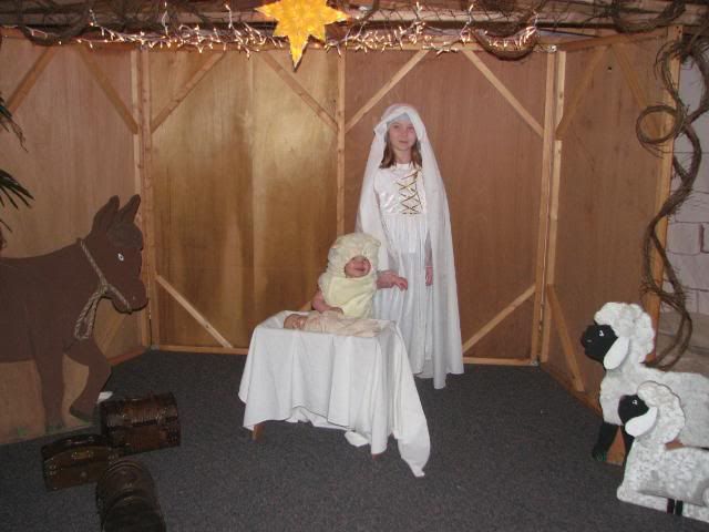 Looks like the lamb escaped.  How fortunate!  Here is the lamb with an angel, with Baby Jesus in the stable.