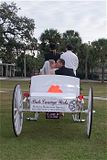 Rebecca and her new husband kissing right after their wedding in our horse carriage.