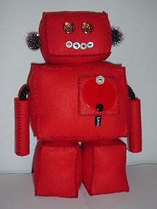 Front view of of a robot doll made from red felt. Image hosted by Photobucket.com