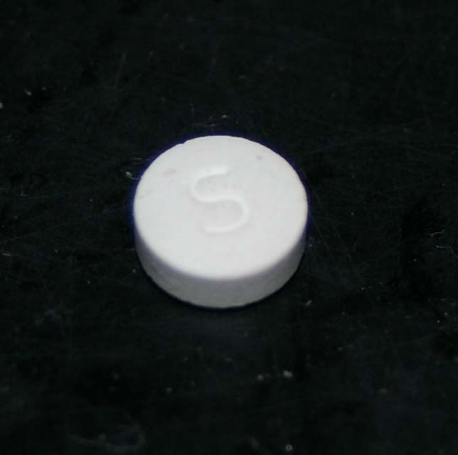 Collection 97+ Images small round white pill with tv on one side Excellent