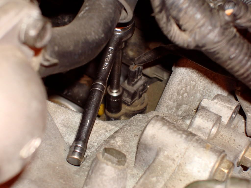 Remove the cotter pins and washers from the shift cables