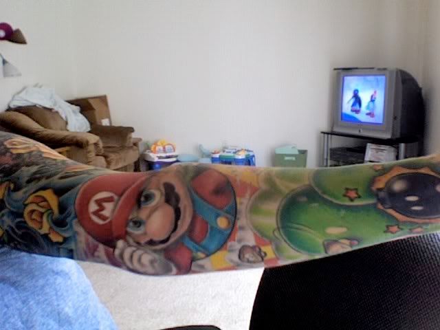 The mario half sleeve is done by Chance Isbell of BLACK HIVE TATTOO in