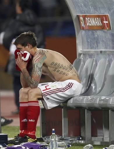 Daniel Agger of Denmark looks crushed after their loss