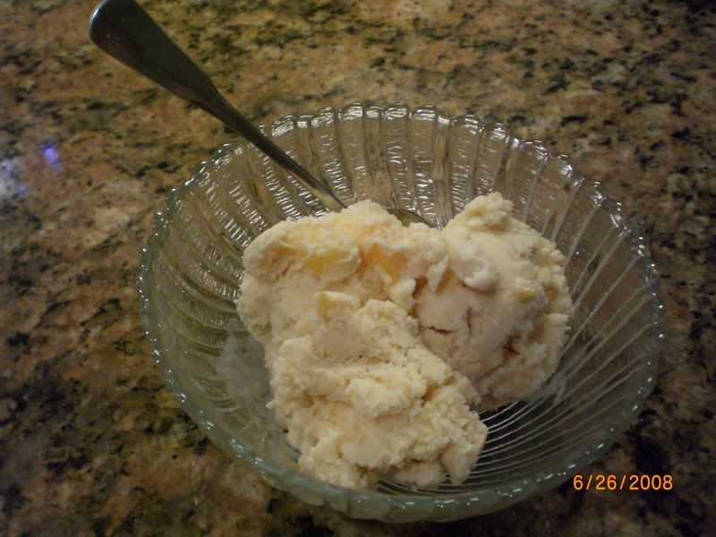 a bowl of peach ice cream
