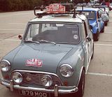 Mini parade. Note the roof rack on the first car.