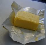 Cube of butter or oleo on open wrapper