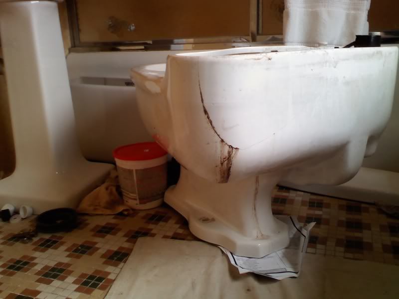Toilet leaking from under bowl