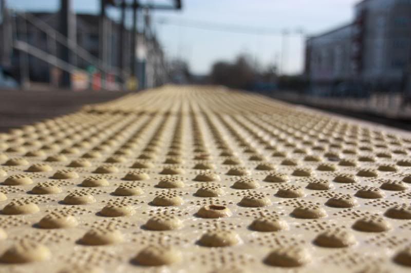 IMAGE: http://img.photobucket.com/albums/v215/darkknight1999/Random%20outdoors/rubberpadsatthetrainstation.jpg