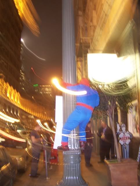Spiderman Midget climbs light pole