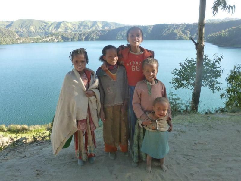Children in the village by Lake Wenchi photo 403159_10101622178004178_617441668_n.jpg