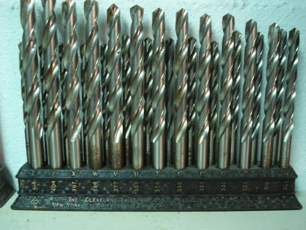 Cast metal drill bit stands