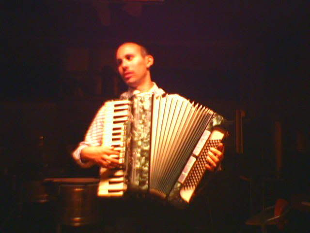 Kenny pretending to play the accordeon. He's our bass player